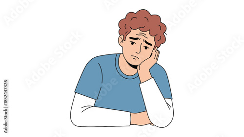 Young man with worried expression resting his head on his hand