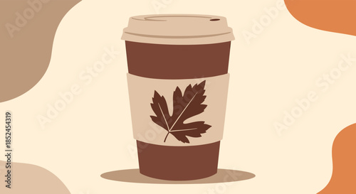 Disposable coffee cup with a maple leaf on the sleeve representing a warm autumn beverage like a pumpkin spice latte.