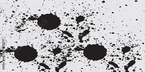 Abstract grunge texture with black speckles and scattered dots on a white background, great for artistic designs.