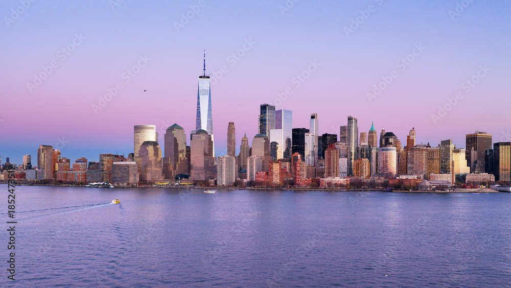 Obraz premium New York skyline with Manhattan Tower. NYC panoramic view of Lower Manhattan skyline. New York City, Manhattan skyline. NYC night cityscape with Manhattan. New York City panoramic skyline.