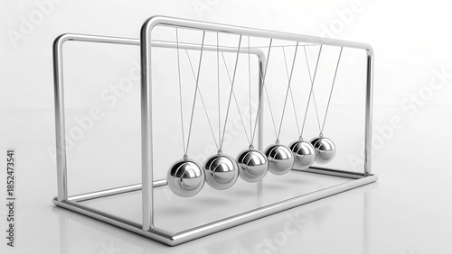 A metallic Newton's cradle with balanced chrome balls suspended in a clean white space, demonstrating principles of physics and perpetual motion.