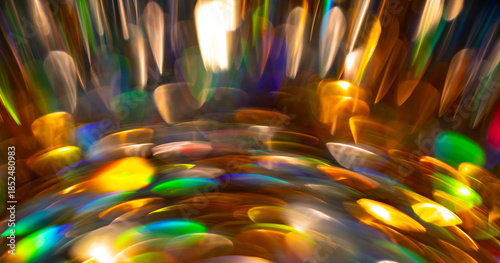 Glitter background with shiny golden sparkles. Glitter bokeh lights. Festive glowing backdrop with shine glitter for celebration design. Vibrant glitter texture. Sparkling abstract pattern.