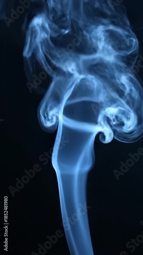 Wallpaper Mural Abstract image of blue smoke against a dark background, swirling and rising Torontodigital.ca