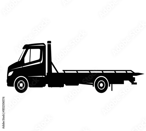 A black silhouette of a flatbed tow truck is depicted in a side view showcasing its design