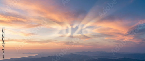 Beautiful Sunset Sky with 2026 Glowing in Sun Rays over Distant Hazy Landscape