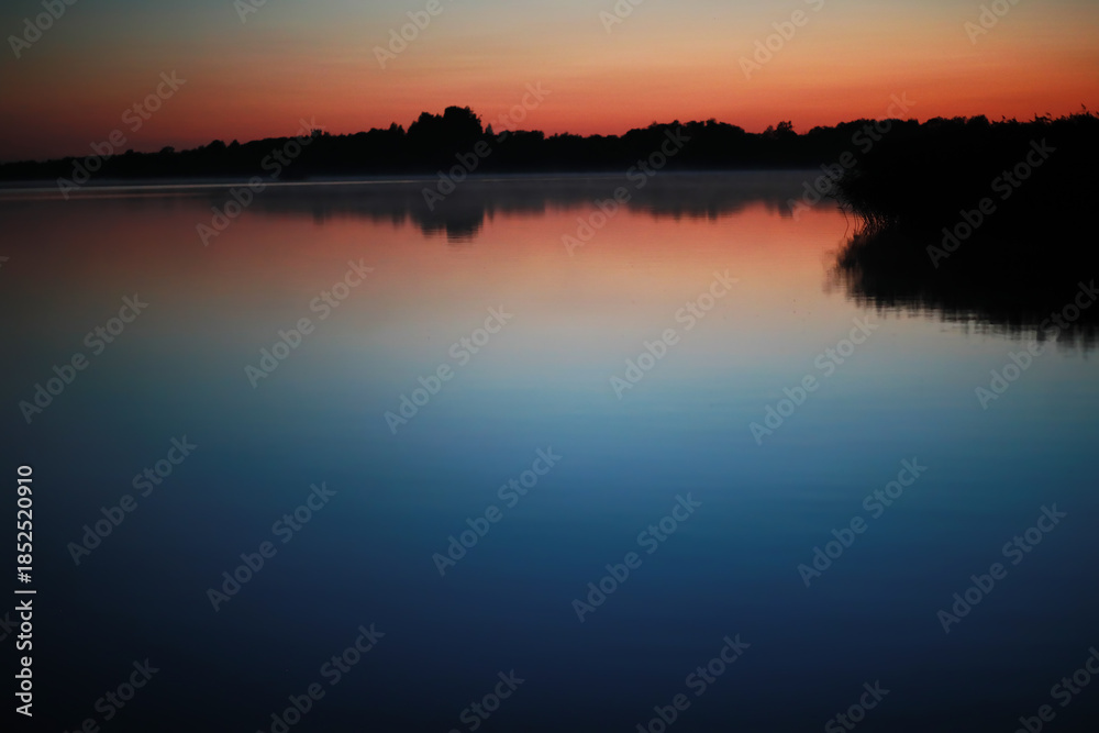 Fototapeta premium Beautiful colour night sky river. Bright moon. Clouds and stars in high mountains.