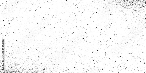 Black ink splatters and dots scattered across a white background