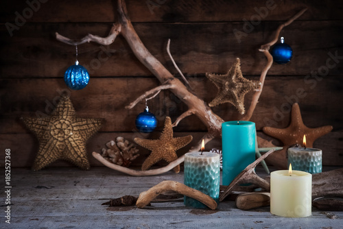 Coastal holiday decor with ornaments on a wooden background