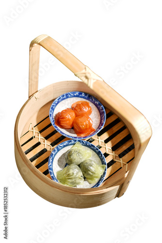 Shrimp dumplings in a bamboo basket (Beetroot dumplings and Spinach dumplings)