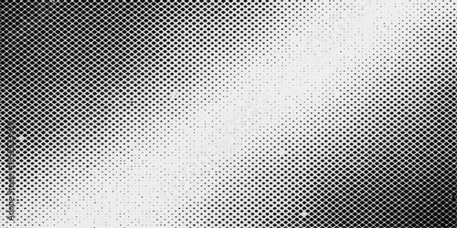 Metallic steel mesh grid background with an abstract seamless carbon fiber pattern and silver gray textured surface design for a dark industrial material backdrop
