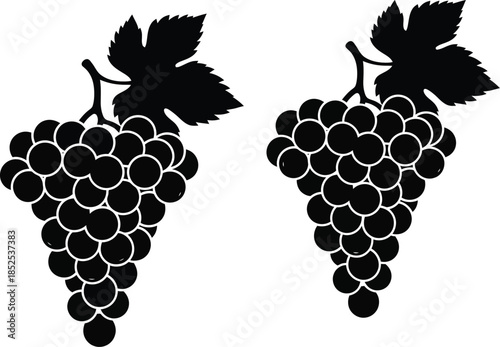 Two bunches of grapes in black silhouette on transparent background