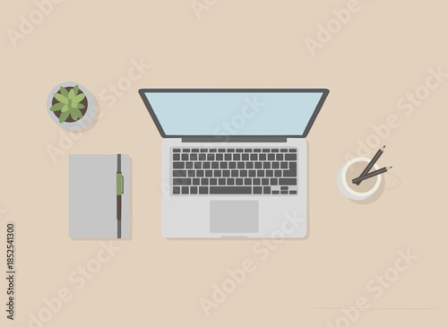 Modern workspace setup with laptop, notebook, and coffee