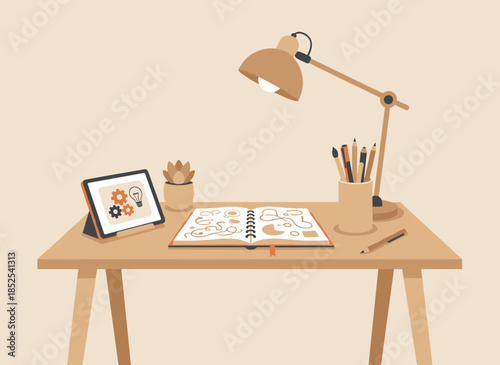 Modern workspace with digital tablet and creative tools on wooden desk