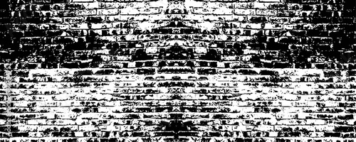 a stark black and white brick wall with a rough texture, creating a high contrast and abstract background