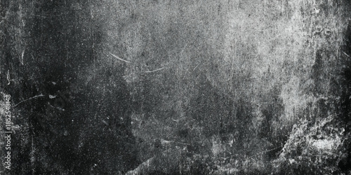 A heavily textured grayscale image featuring abstract patterns and indistinct forms evoking a sense of age and decay