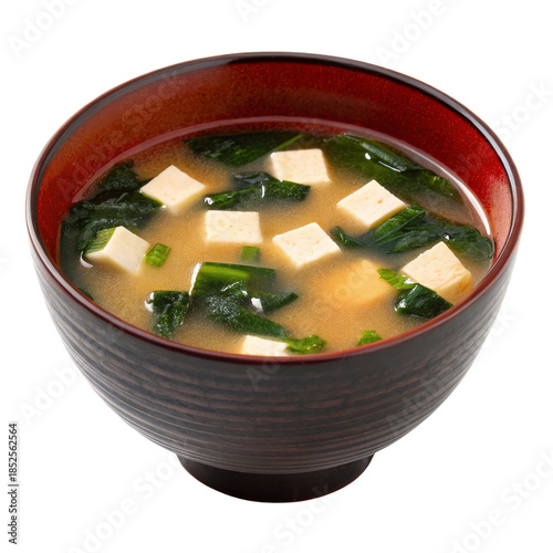 Miso soup with tofu and seaweed in a traditional wooden bowl isolated on white background