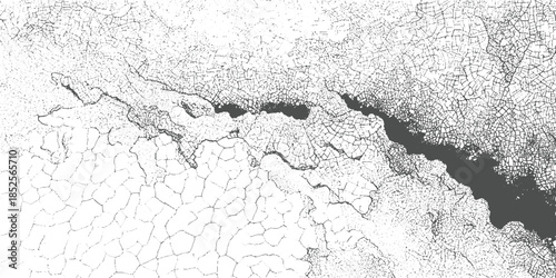 Black and white cracked texture with dark irregular shapes abstract background