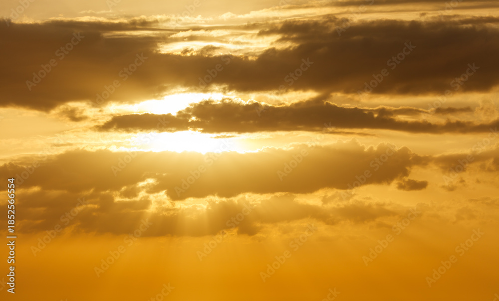 Fototapeta premium The sun is shining through the clouds