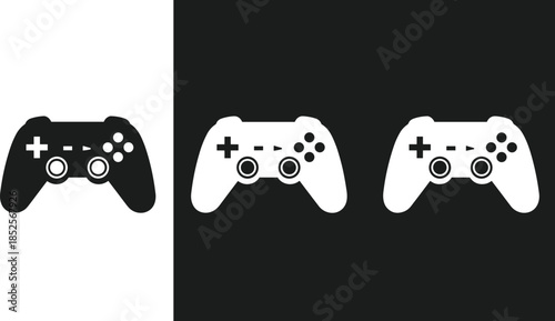 Game controller and gift box icons in black and white solid style isolated on contrasting backgrounds
