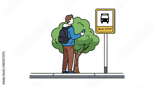 Young man with backpack checks his phone while waiting at a bus stop by a tree