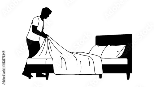 Man making a bed with fresh white sheets and pillows for a clean and comfortable bedroom.