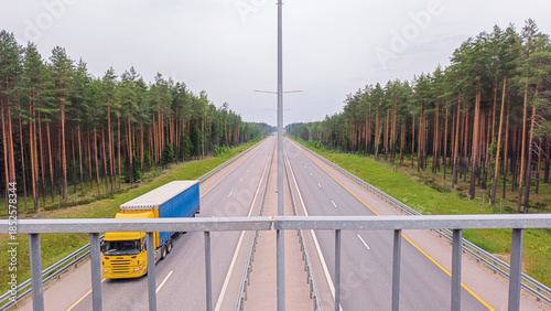 Russia. The M11 highway with cars moving along it. Aerial view from the overpass