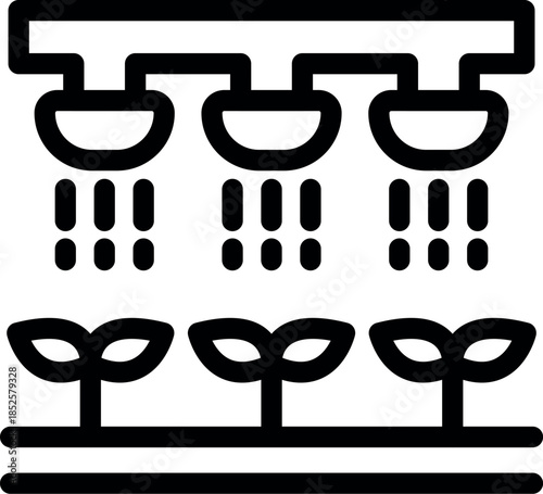 Automated irrigation system nurturing young plants in a controlled environment, ensuring optimal growth and resource management