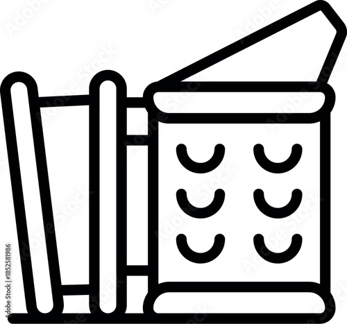 Beekeeper extracting honeycomb frame from beehive using special tool, during honey harvest in apiary