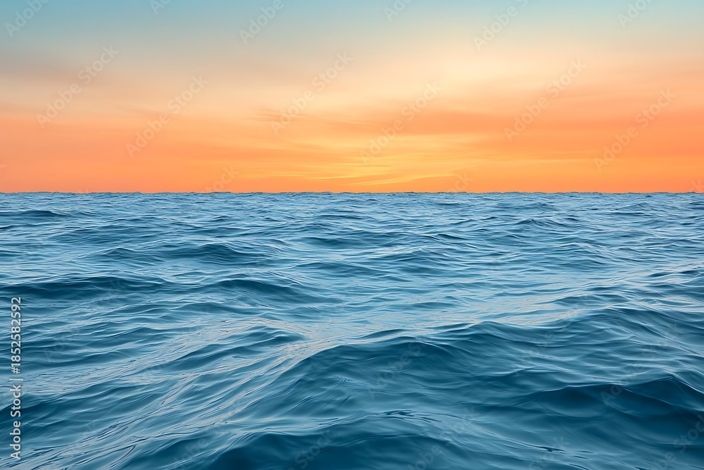 Obraz premium Serene Ocean View at Dusk with Gentle Waves Under a Colorful Sky at Sunset