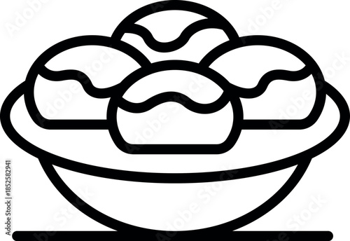 Three takoyaki balls are served in a bowl, showcasing a popular japanese street food