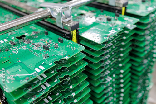 Tableau sur toile Stack of assembled circuit boards in metal rack at modern electronics factory