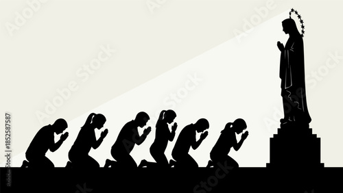 People kneeling in prayer before a statue of a religious figure on a pedestal in a solemn moment.