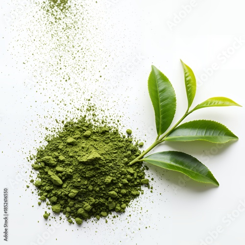 Matcha green tea powder and fresh tea leaves on white background