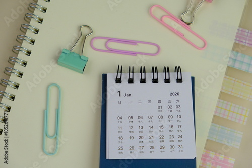 word 2026 on green calendar nearby colorful office tools as a 2026 calendar concept