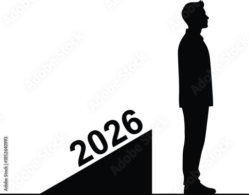 Silhouette of a businessman standing beside a ramp leading to the year 2026 symbolizing future goals and planning