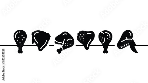 Black chicken pieces hanging on a line for cooking