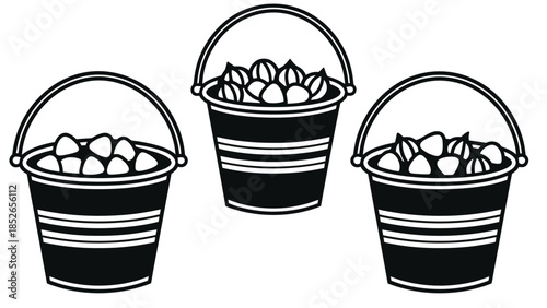 Black buckets filled with stones and shells