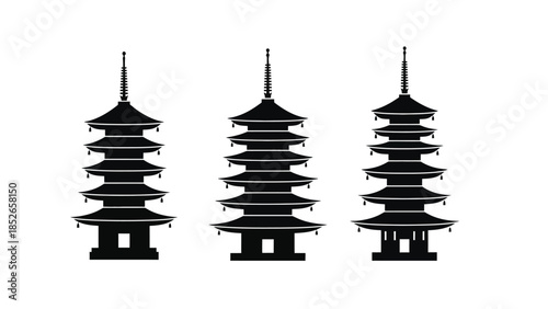 Three traditional Asian pagoda towers in black silhouette