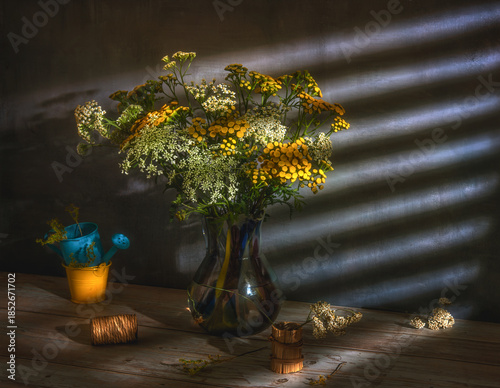 A bouquet of meadow flowers close-up on a dark background.