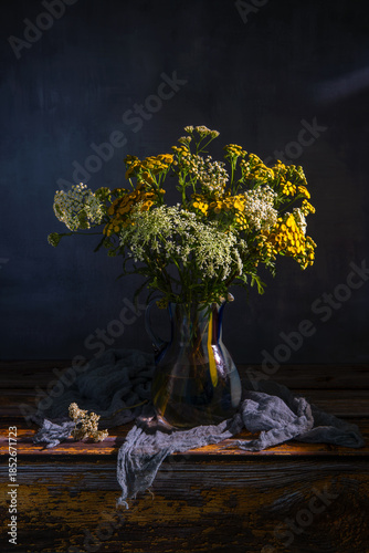 A bouquet of meadow flowers close-up on a dark background.
