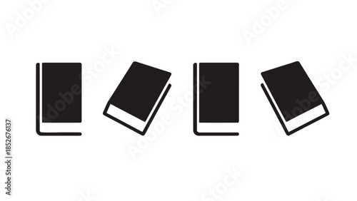 Four black books with white pages in different positions on a white background