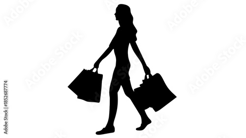 Silhouette of woman carrying shopping bags walking alone
