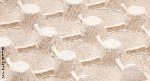 Abstract macro texture of empty papier-m ch egg packaging. Environmentally friendly recycled paper material, concept of recycling, sustainable development, and organic products.