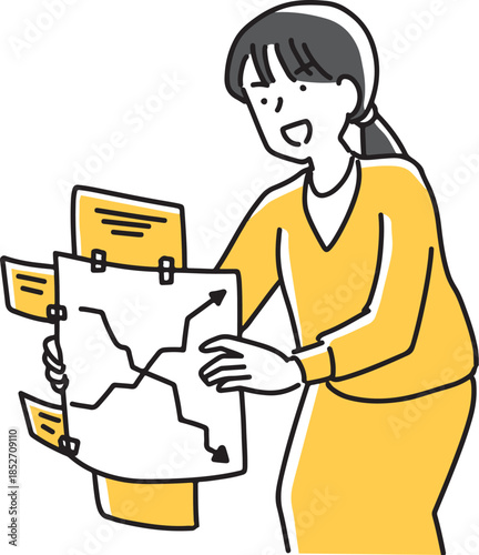 つぎはぎされた企画書を見せる女性社員