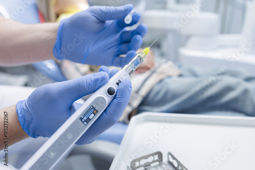 Tablou pe pânză Endodontic device with file for root canal treatment in modern dental clinic