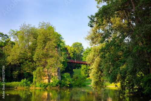 Suspended footbridge over the lake in the Buttes-Chaumont park 19th arrondissement of Paris city