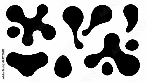 Abstract black shapes on a white background resembling ink blots or amoebas