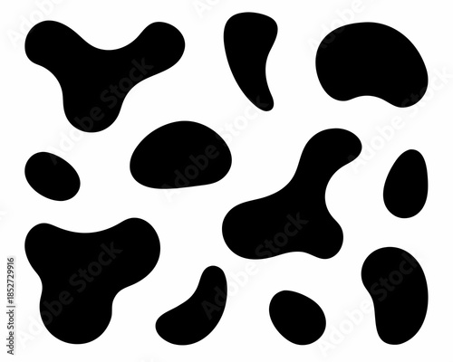 Abstract black shapes on a white background resembling a spotted pattern