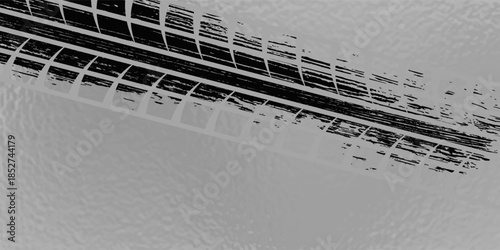 Black tire marks on road, Black rubber tire marks and tread marks, Tire trace track wheels texture and background, Auto tire tread grunge, Car wheel tyre tread track black tyre print, Top view.