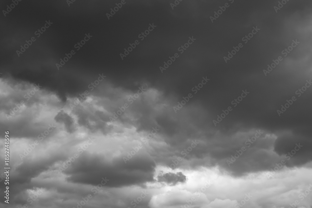 Obraz premium Black and white dramatic cloudy sky background. Weather conditions on an autumn day